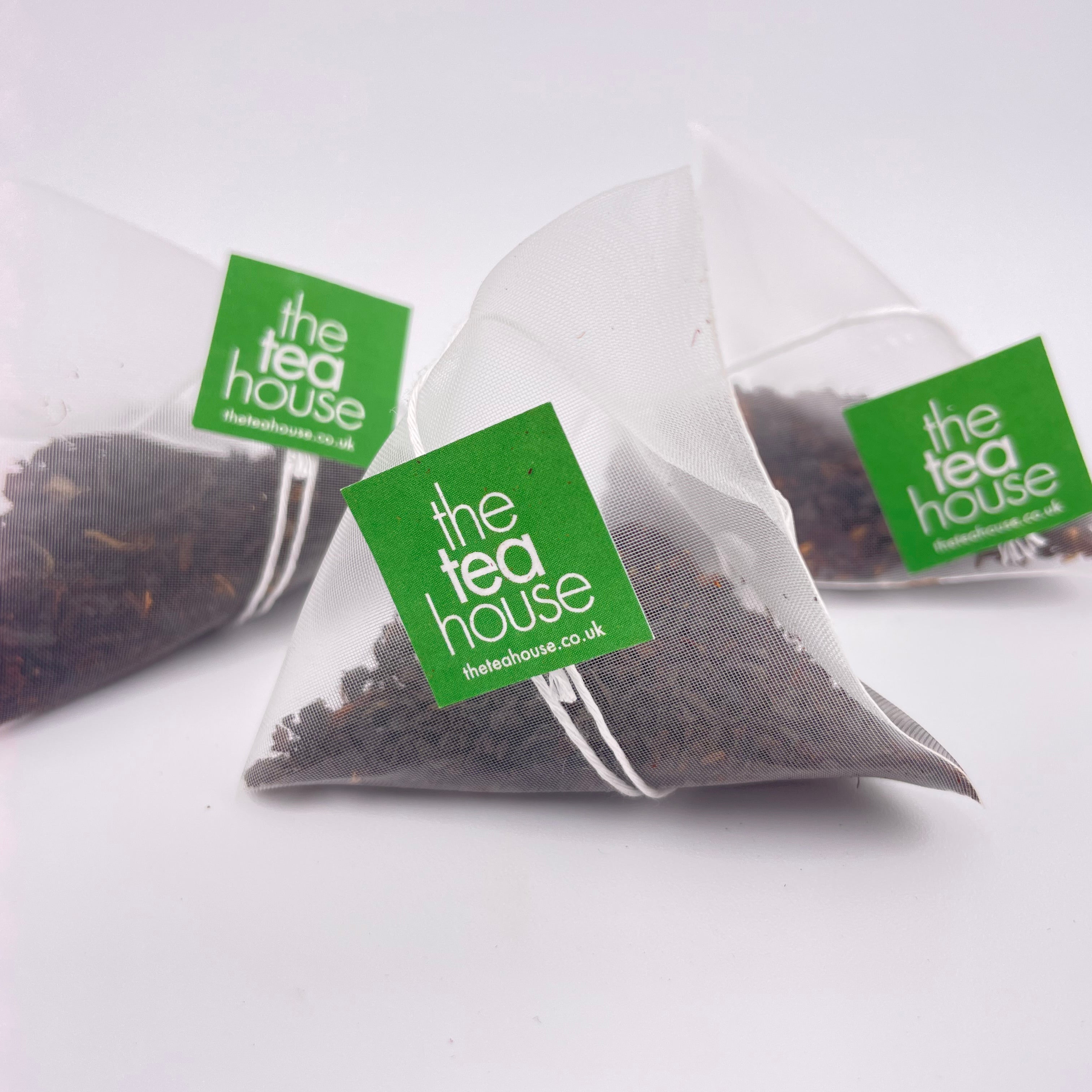 Tea bags with 'The Tea House' label on a white background