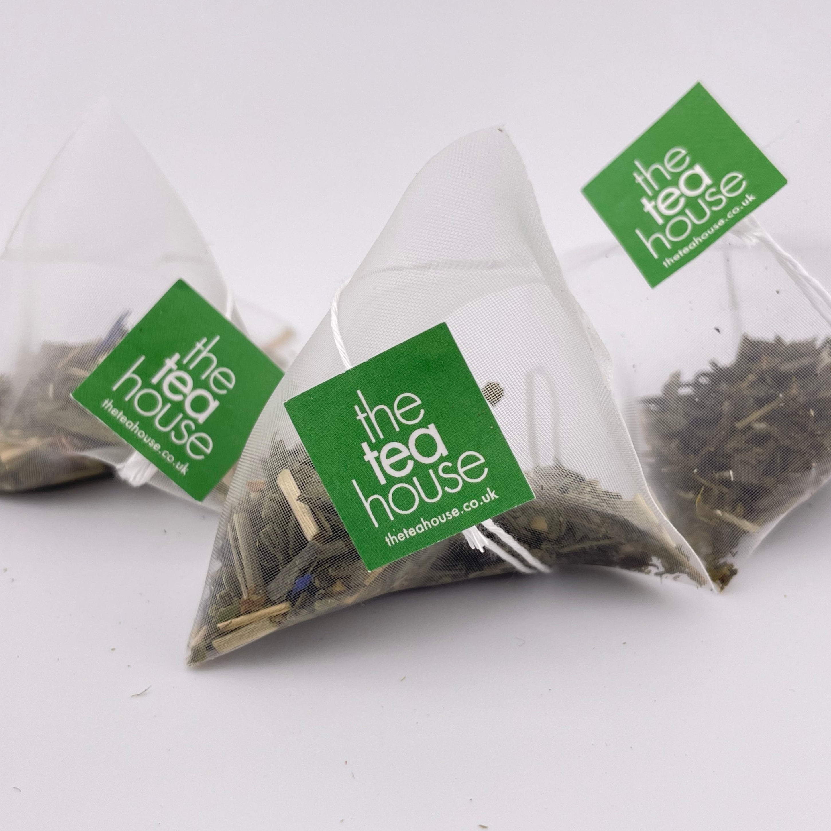 Tea bags with 'The Tea House' label on a white background
