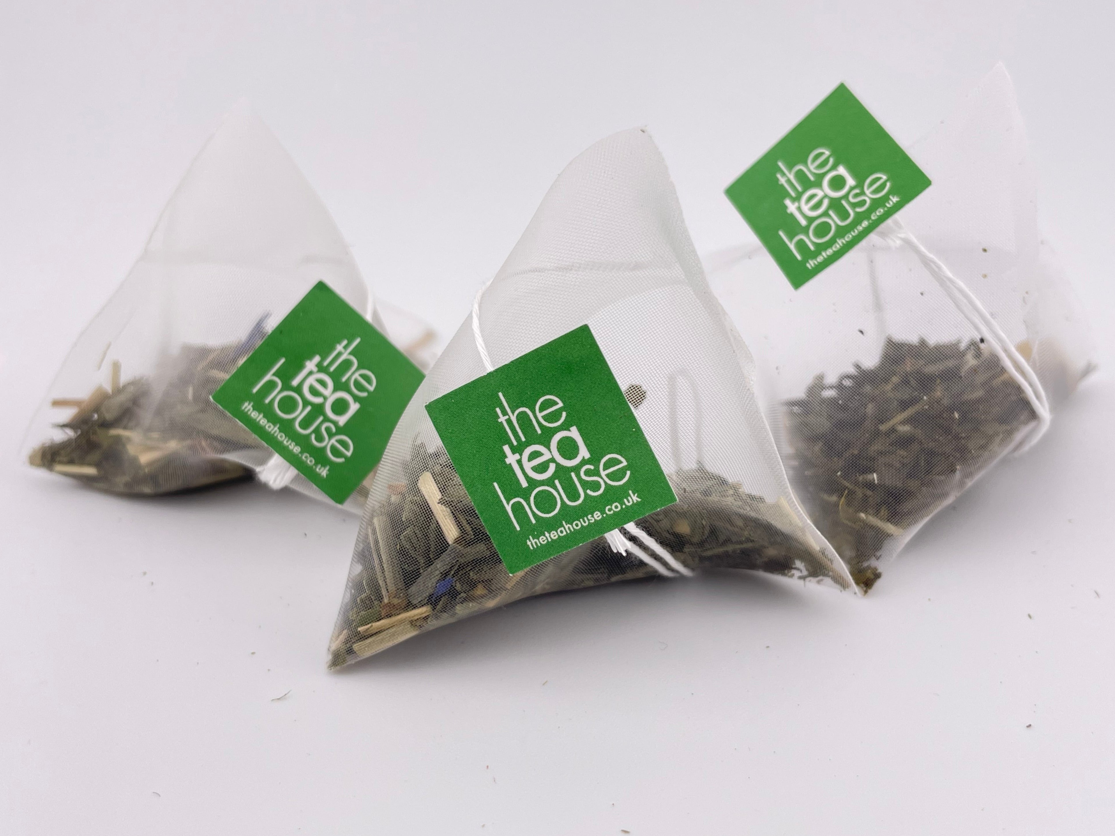 Tea bags with 'The Tea House' label on a white background