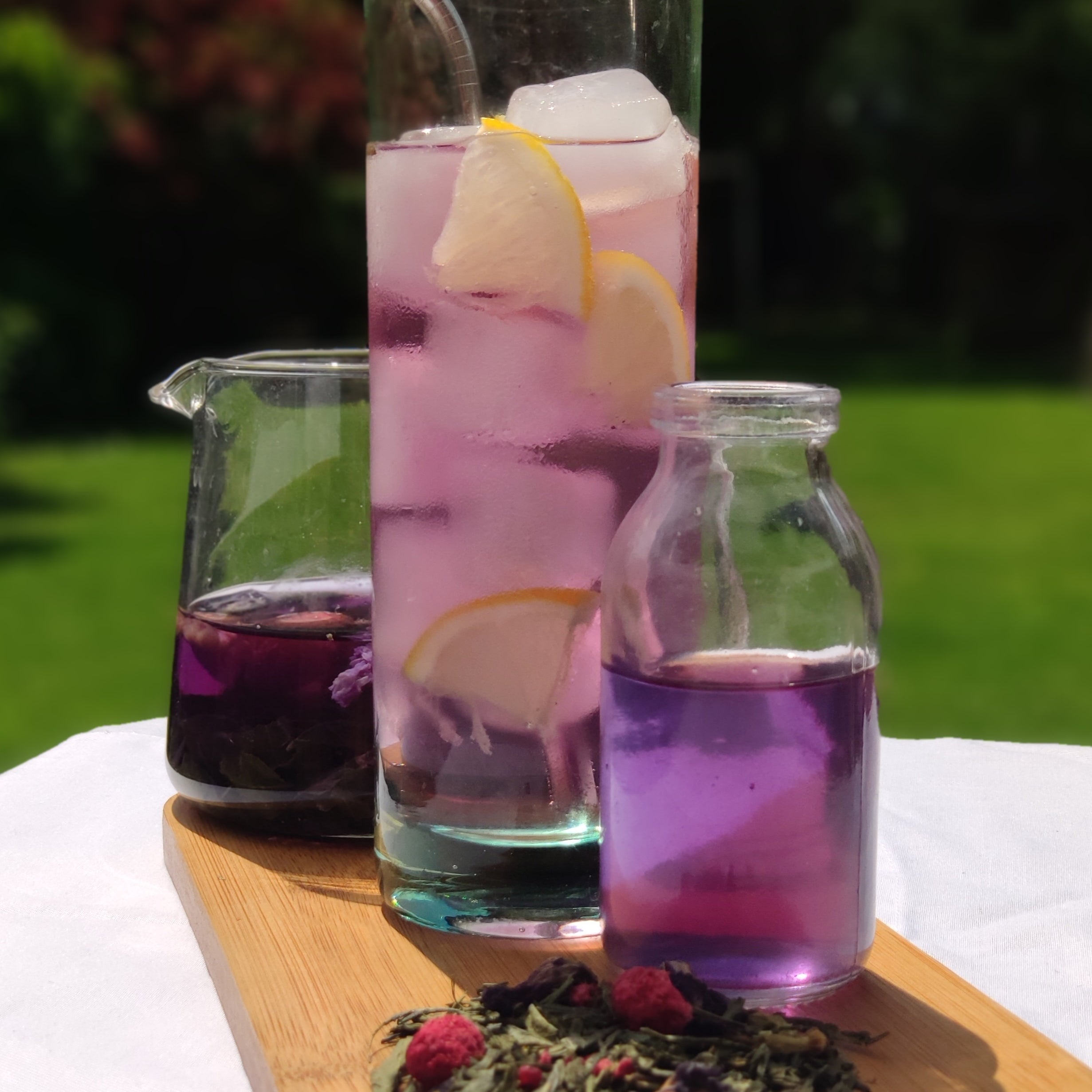 tall clear glass of purple liquid tea