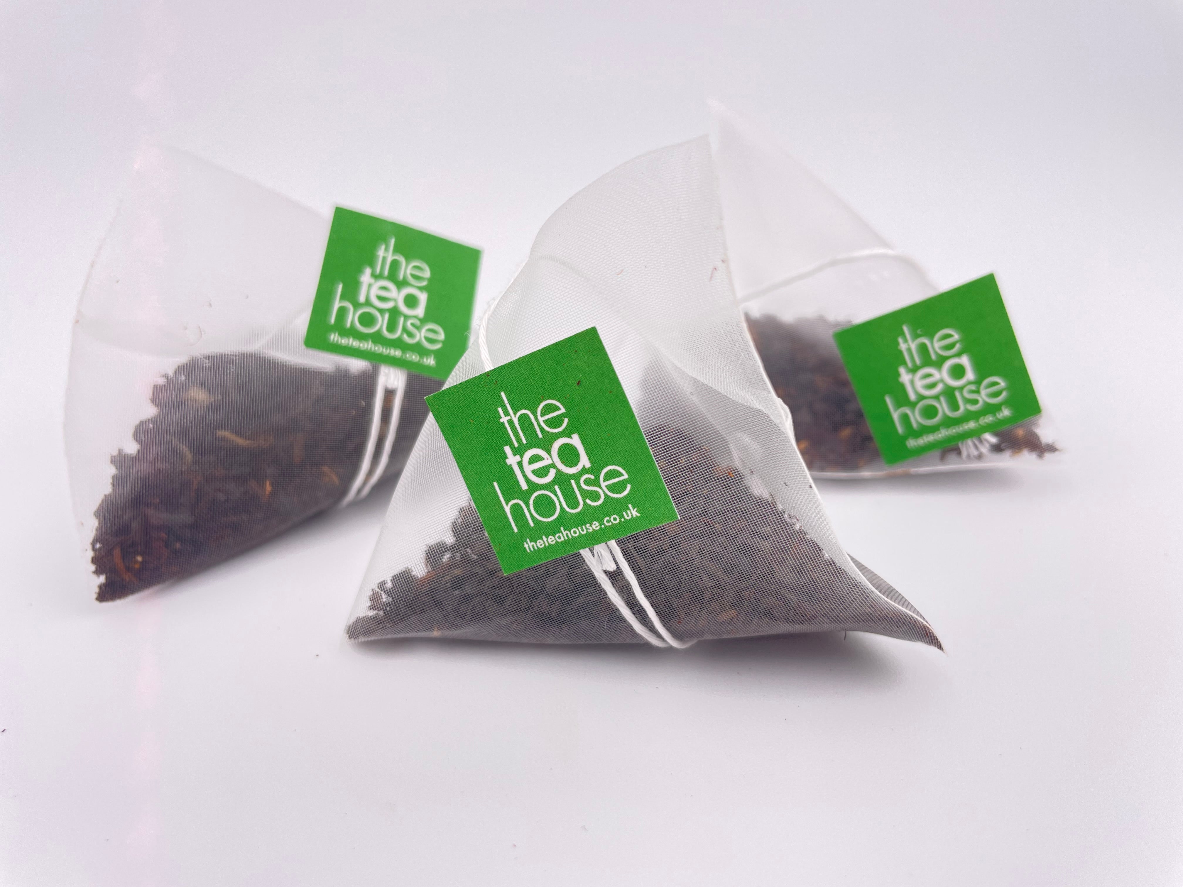 Tea bags with 'The Tea House' label on a white background
