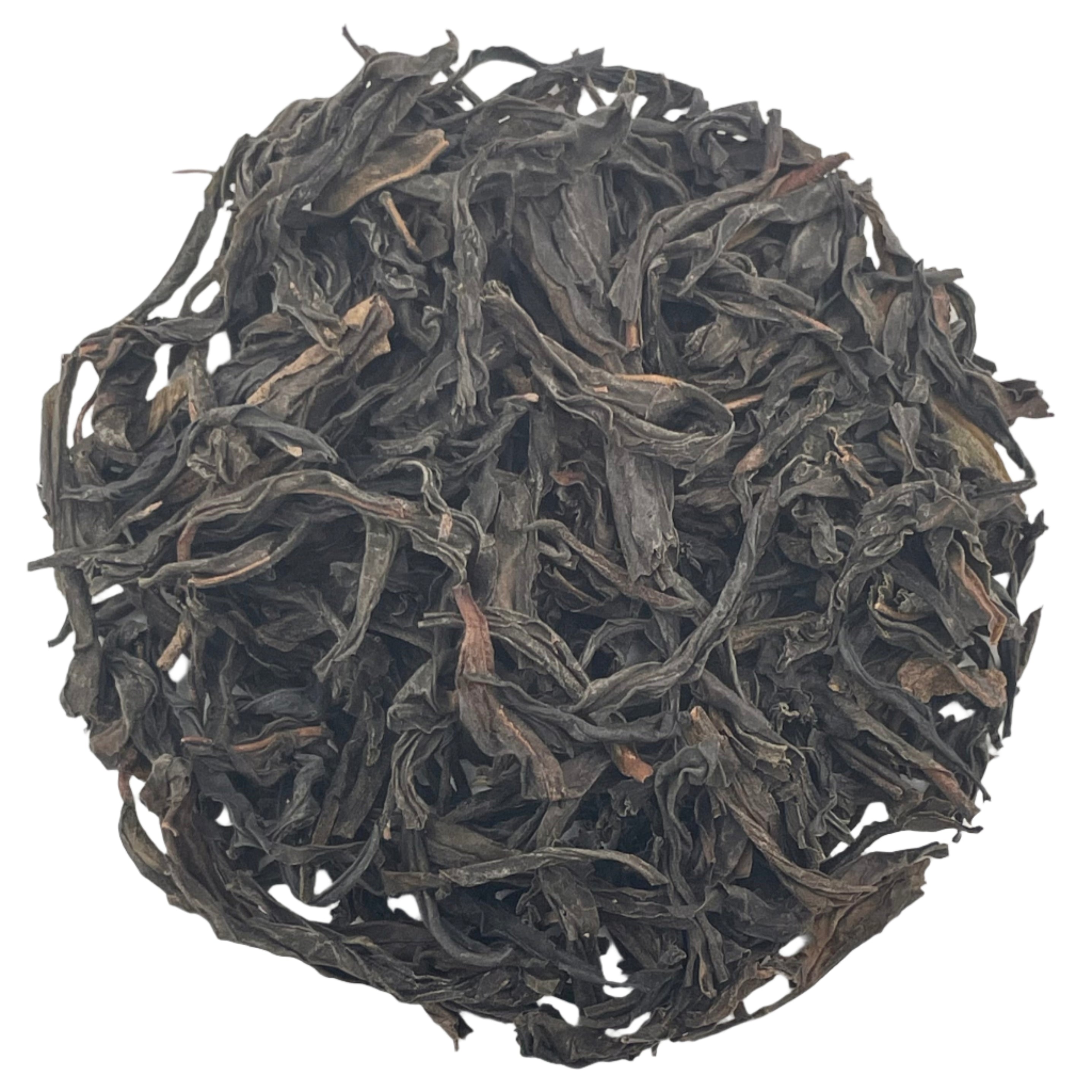 Ball of black tea leaves on a white background