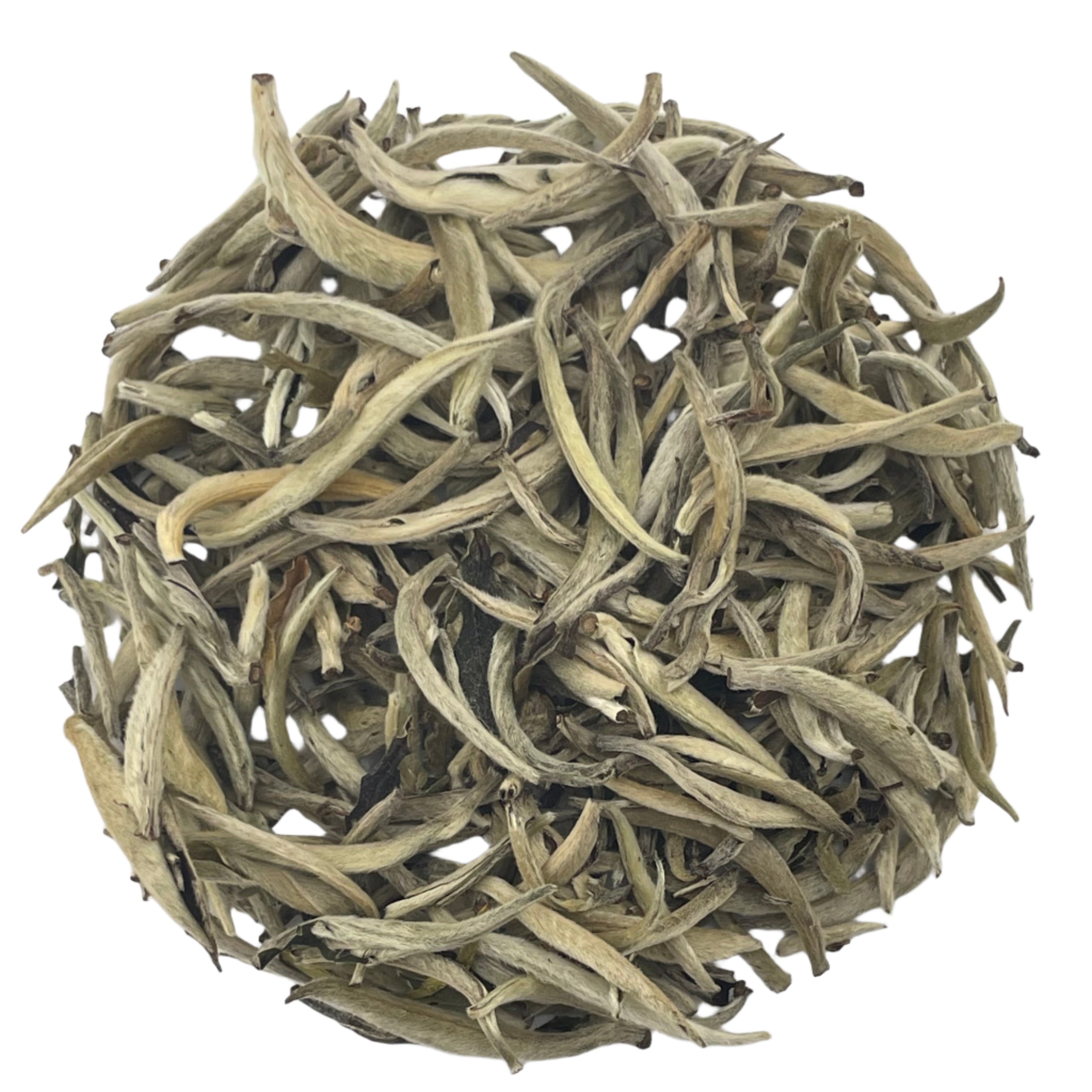 Dry tea leaves on a white background